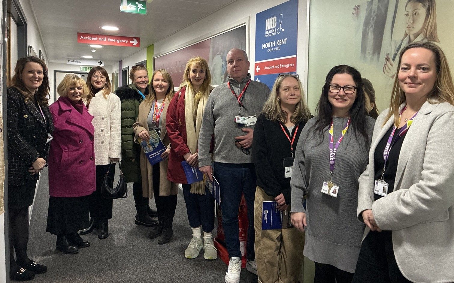 Group of people stood in corridor