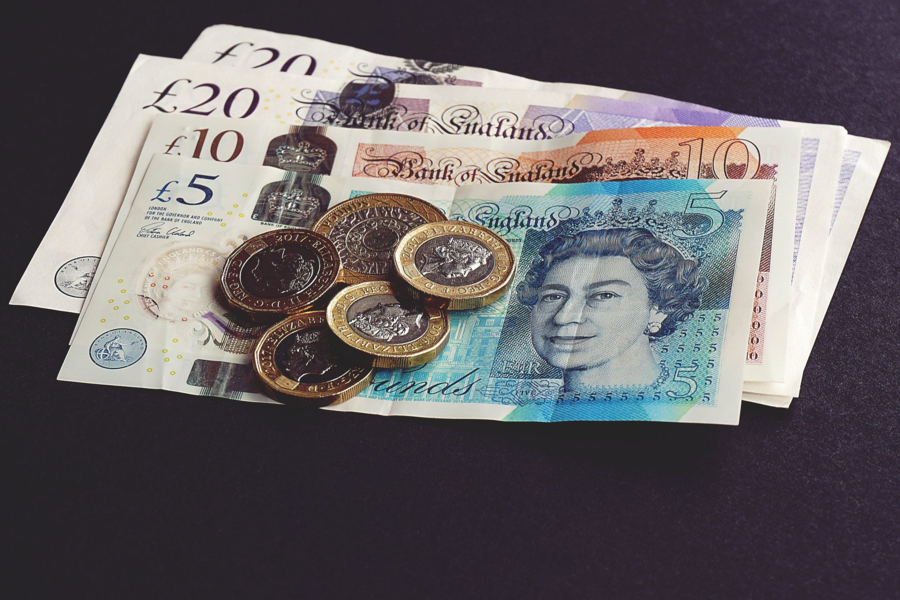 Finance_Notes_and_Coins_on_table