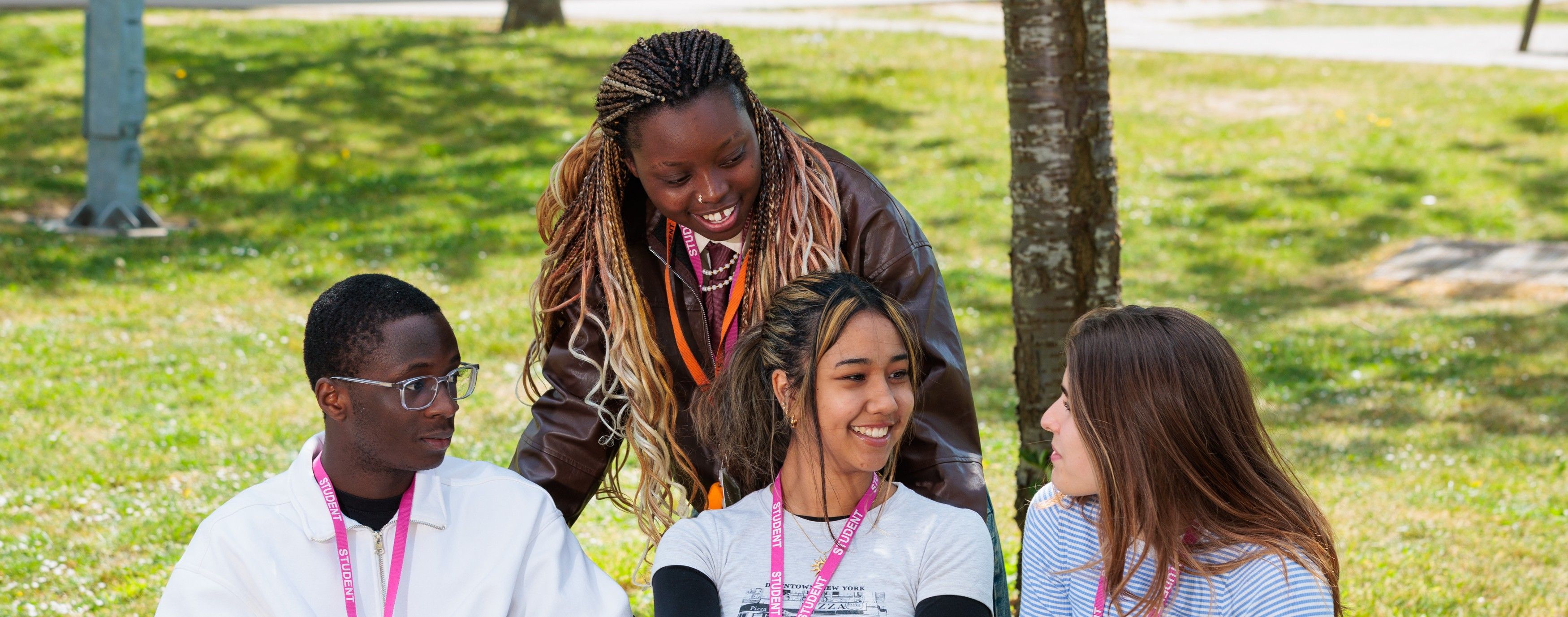 dartford-college-group-of-students-talking-on-bench